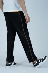 Step up your casual style with these Black Joggers for Men with Yellow Accents. Designed with a unique yellow back panel, yellow side stitching, and a hidden zip pocket, these joggers offer both style and secure storage. Whether for the gym, outdoor adventures, or relaxed days, these joggers bring comfort and a bold look to any outfit.