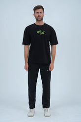Trendy oversized black t-shirt for men with a bold biker-inspired graphic, ideal for casual and urban wear. - Ride Fast Oversized T-Shirt - Xea Clothing