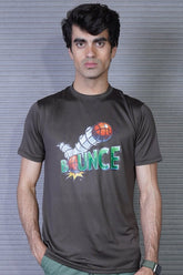 Person wearing a dark gray t-shirt with a colorful graphic and text against a striped background