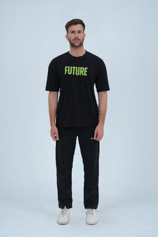 A black oversized drop-shoulder T-shirt with bold green "FUTURE" lettering on the front, making a strong statement in streetwear fashion.
