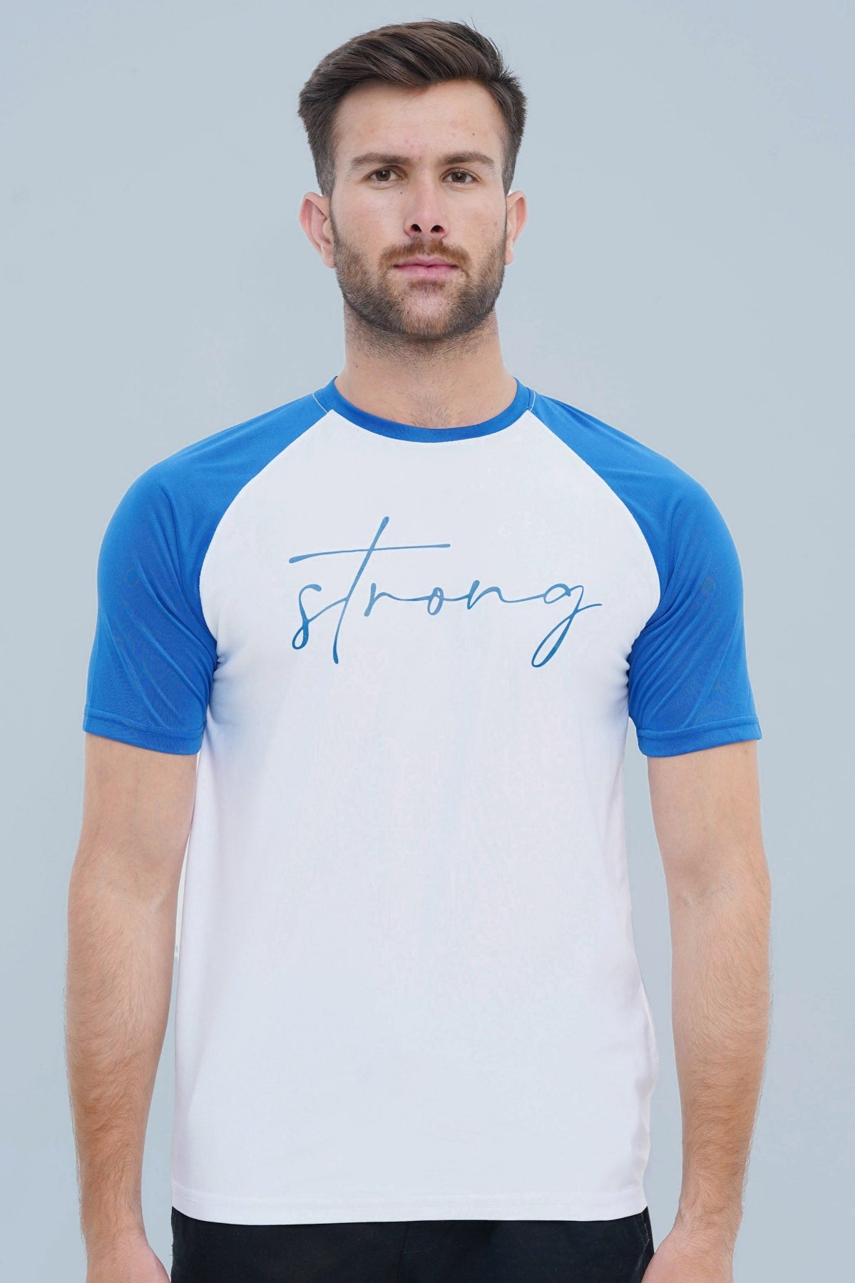 Man wearing a white t-shirt with blue sleeves and 'strong' text on a gray background