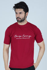 Man wearing a red t-shirt with text and black shorts on a white background