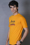 Man wearing a yellow t-shirt with text against a gray background