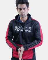 Person wearing a black and red hoodie with 'Think Positive' text on a light gray background