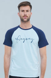 Man wearing a light blue and navy baseball shirt with 'Anyway' text on a gray background