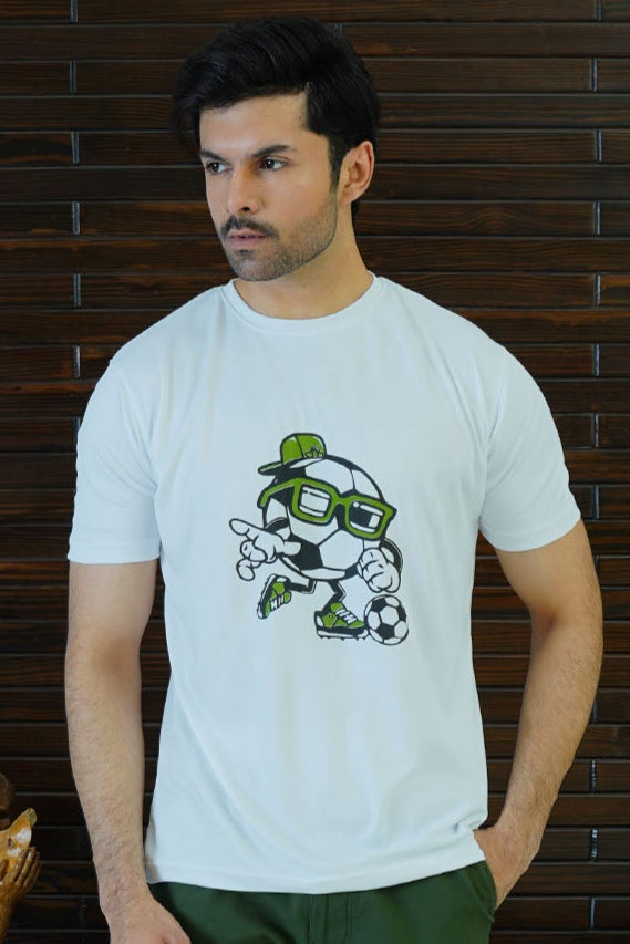 Man wearing a white t-shirt with a graphic design against a wooden paneled background