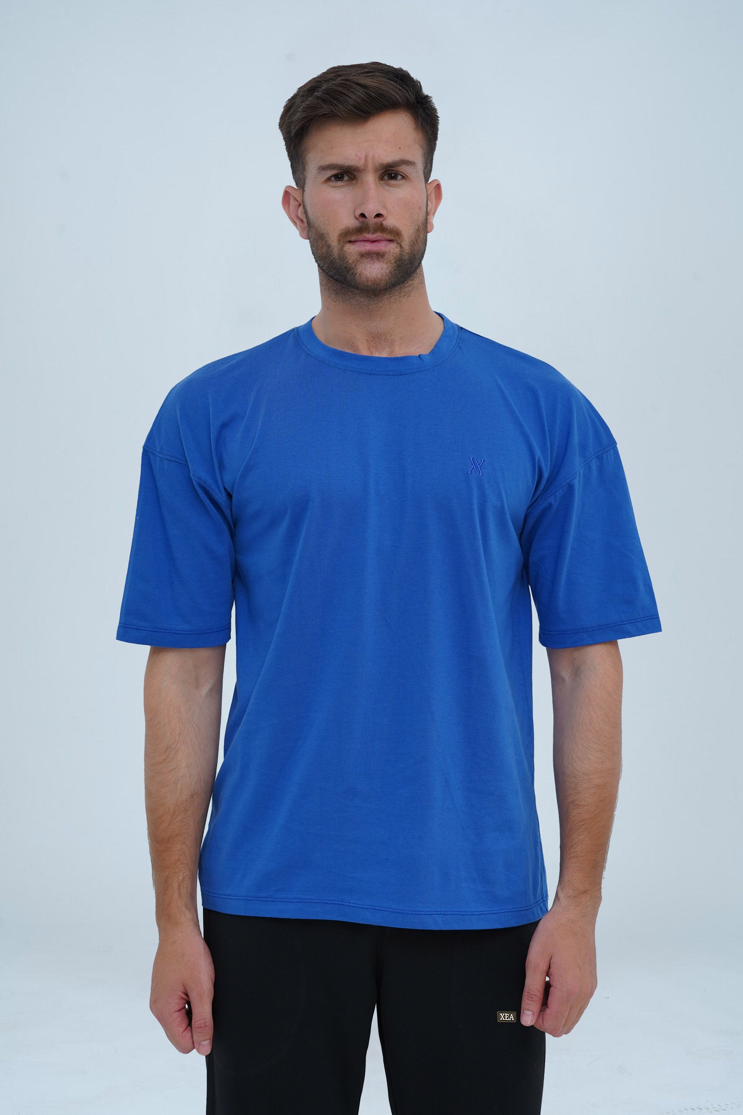 Deep sapphire blue drop shoulder oversized T-shirt – breathable fabric, minimal design, and a modern streetwear essential.