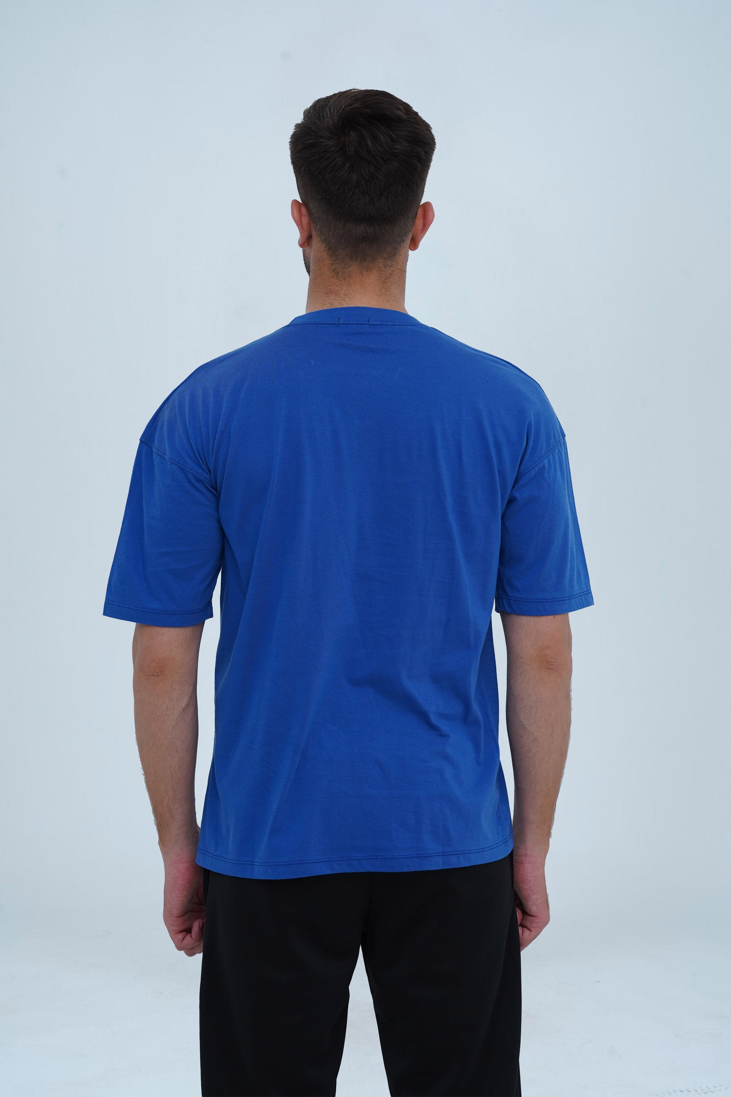 Essential sapphire blue drop shoulder T-shirt for men – oversized fit, premium cotton, and a bold yet stylish look.