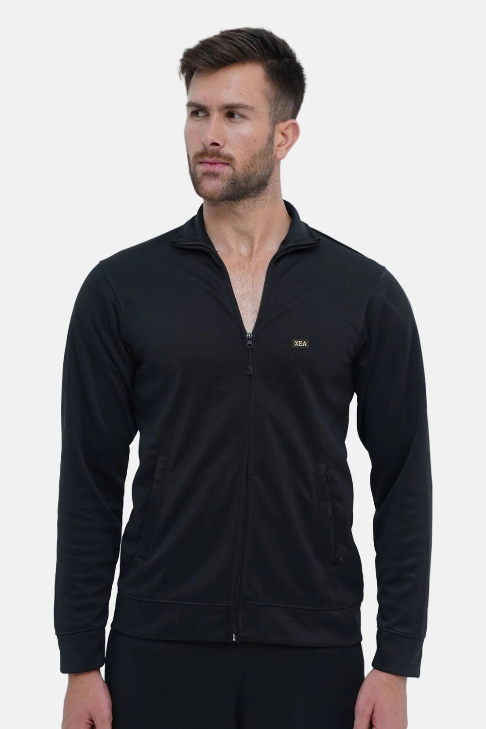 Man wearing a black zip-up sweatshirt on a white background