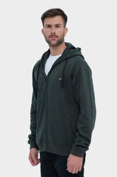 Man wearing a green hoodie on a white background