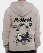 Person wearing a beige hoodie with a graphic design on the back against a light gray background