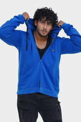 Person wearing a blue hoodie on a white background