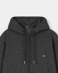 Dark gray hoodie with brand logo on a light gray background