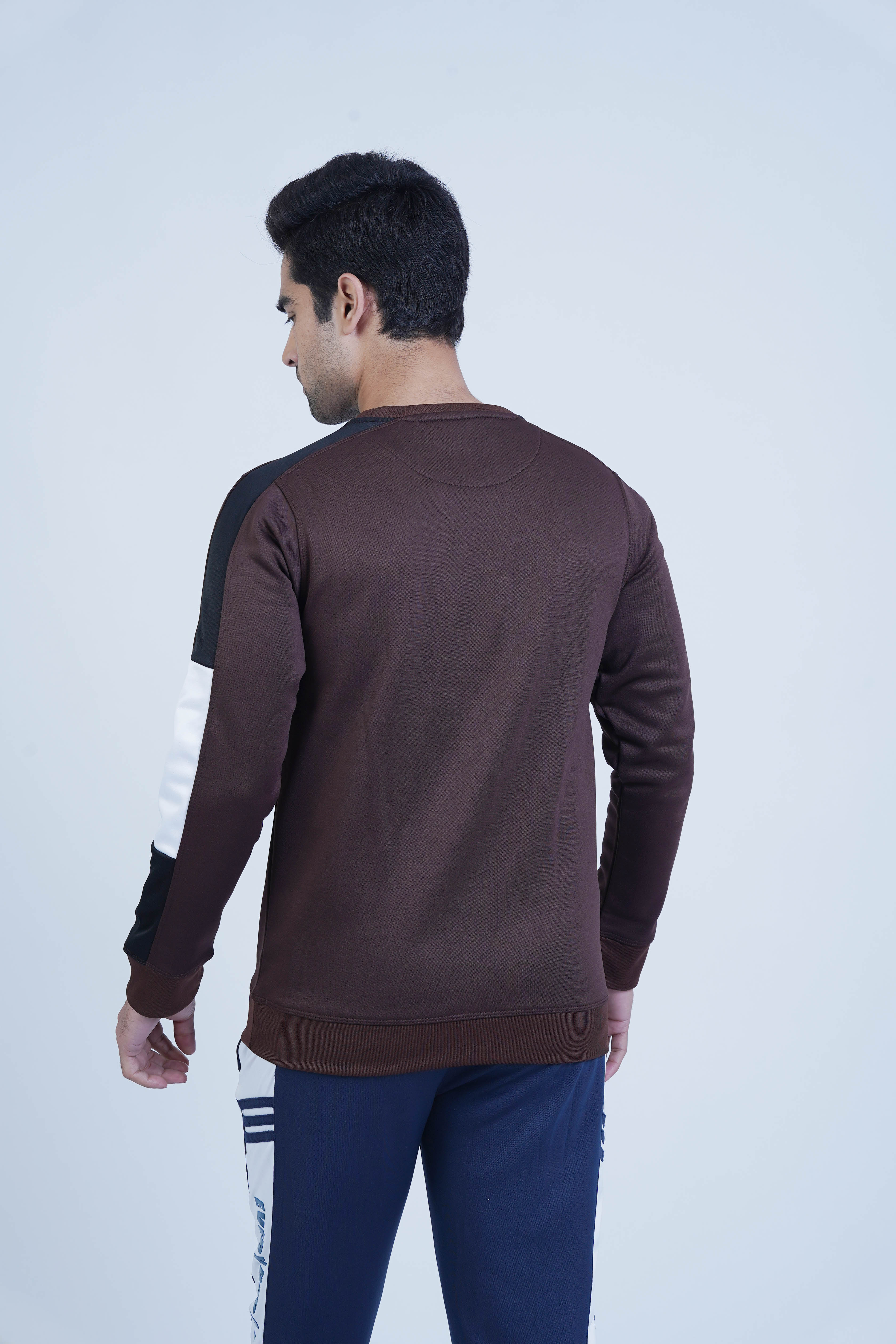 Casual brown sweatshirt with bold black and white stripes on each sleeve, adding a dynamic, modern touch.