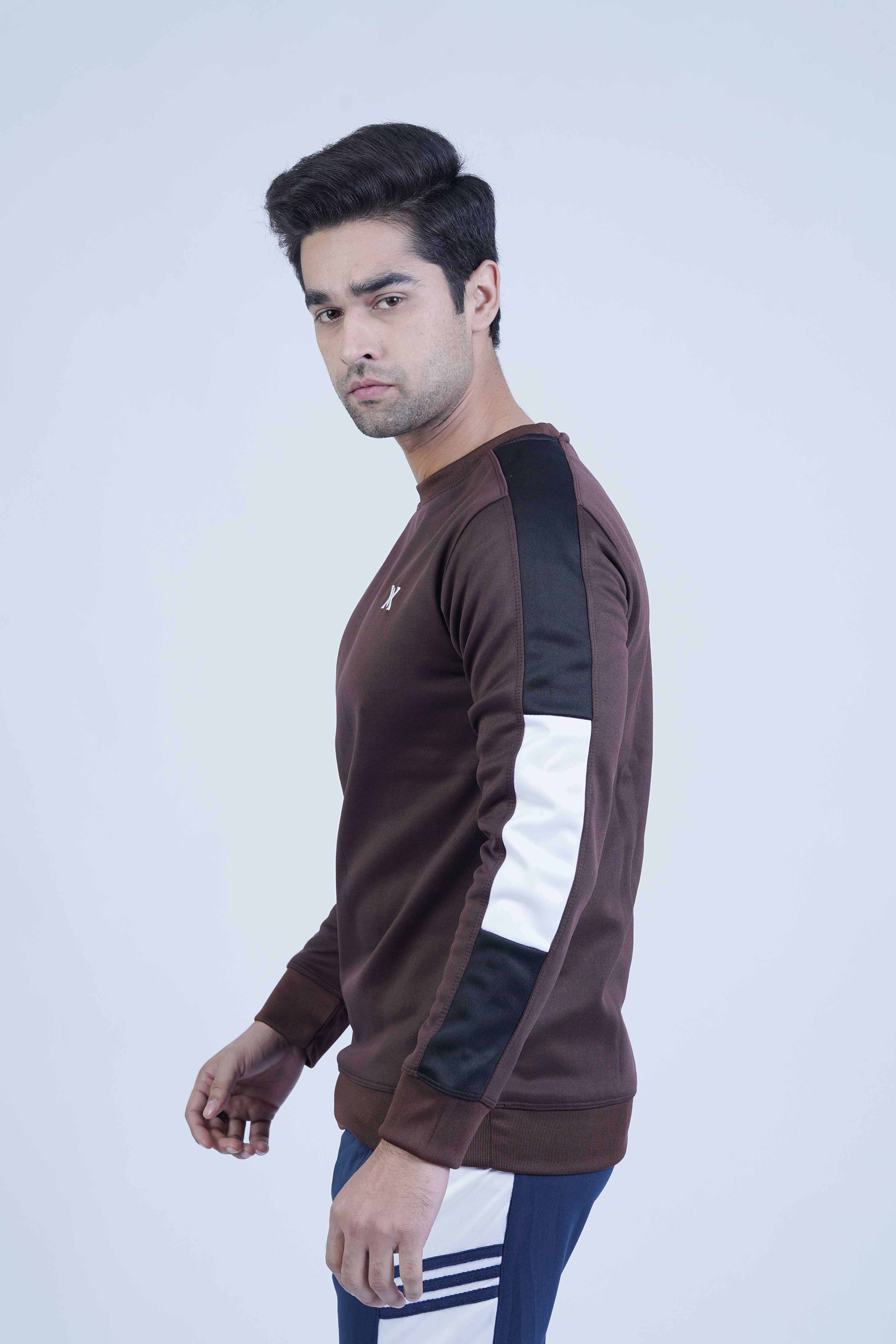 A warm brown crewneck sweatshirt with bold black and white stripes along the sleeves, providing a modern, sporty look.