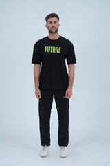 A black oversized drop-shoulder T-shirt with bold green "FUTURE" lettering on the front, making a strong statement in streetwear fashion.