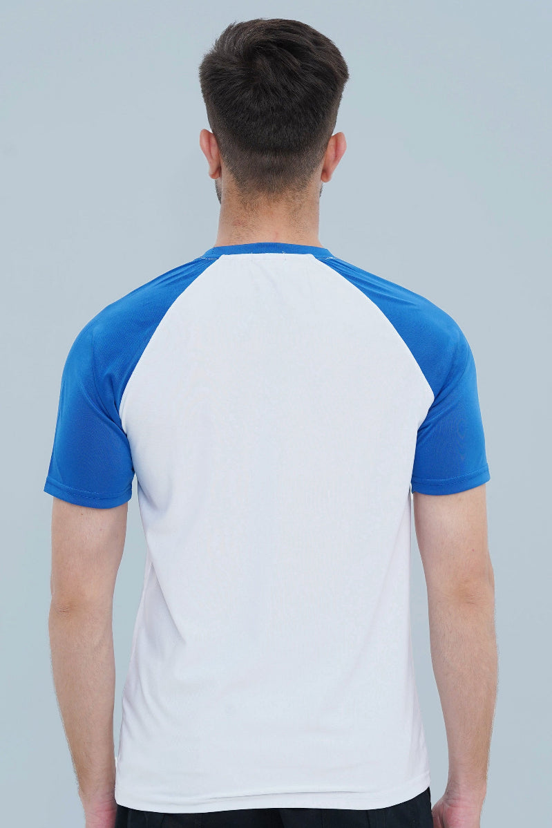 Person wearing a white and blue baseball shirt against a gray background