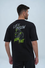Men’s oversized black t-shirt featuring a bold "Life Slow, Ride Fast" graphic with a biker illustration on the back. -  Ride Fast Oversized T-Shirt - Xea Clothing -  Ride Fast Oversized T-Shirt - Xea Clothing