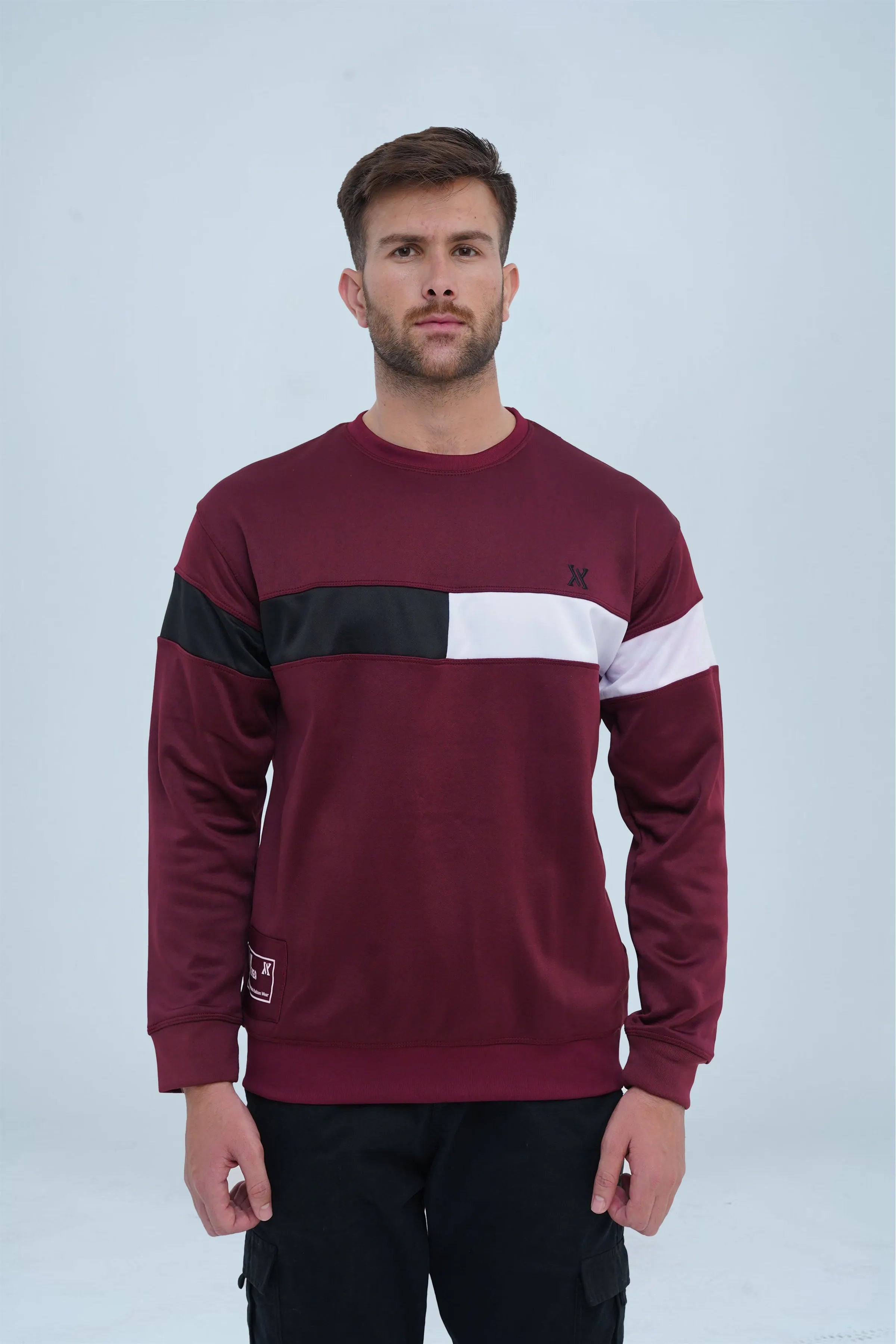 Deep maroon crewneck sweatshirt featuring a black and white stripe across the chest for a sporty, stylish look. -  Color Block Maroon Sweatshirt - Xea Clothing -  Color Block Maroon Sweatshirt - Xea Clothing