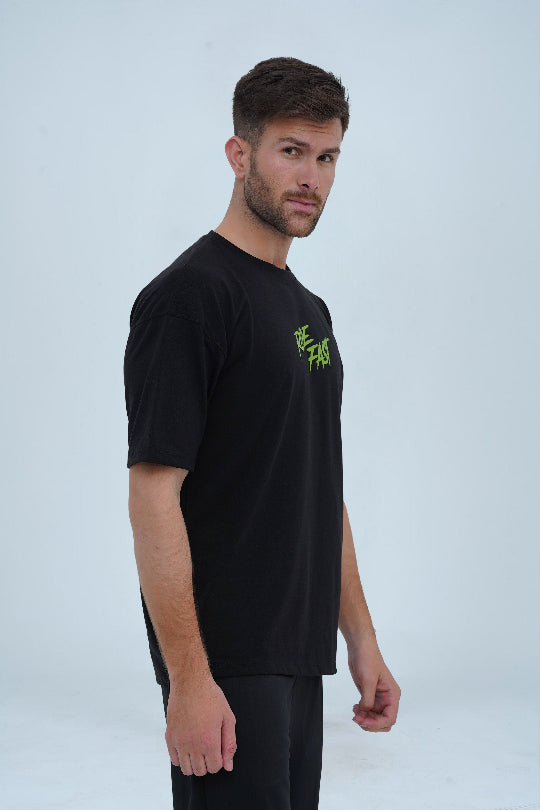 XEA Clothing’s oversized t-shirt in black with striking neon green typography and edgy streetwear design. -  Ride Fast Oversized T-Shirt - Xea Clothing