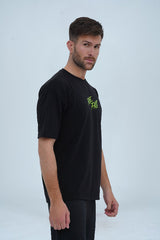 XEA Clothing’s oversized t-shirt in black with striking neon green typography and edgy streetwear design. -  Ride Fast Oversized T-Shirt - Xea Clothing