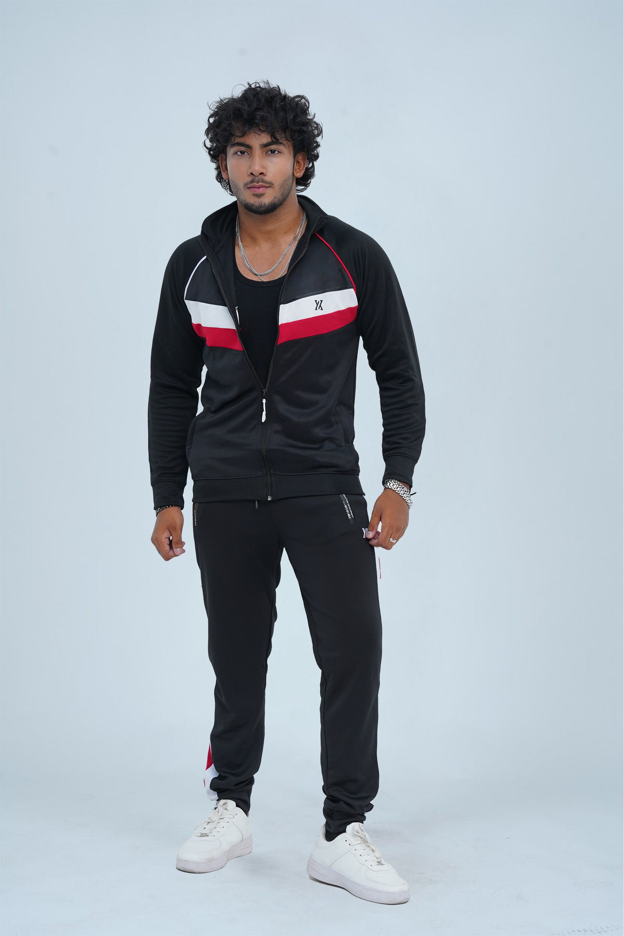 Stay stylish and warm this winter with our Men's Fitness Tracksuit in Black. Designed for top performance, this tracksuit features breathable fabric and striking red and white accents. Perfect for any workout, its flexible fit and bold design will keep you active and fashionable.