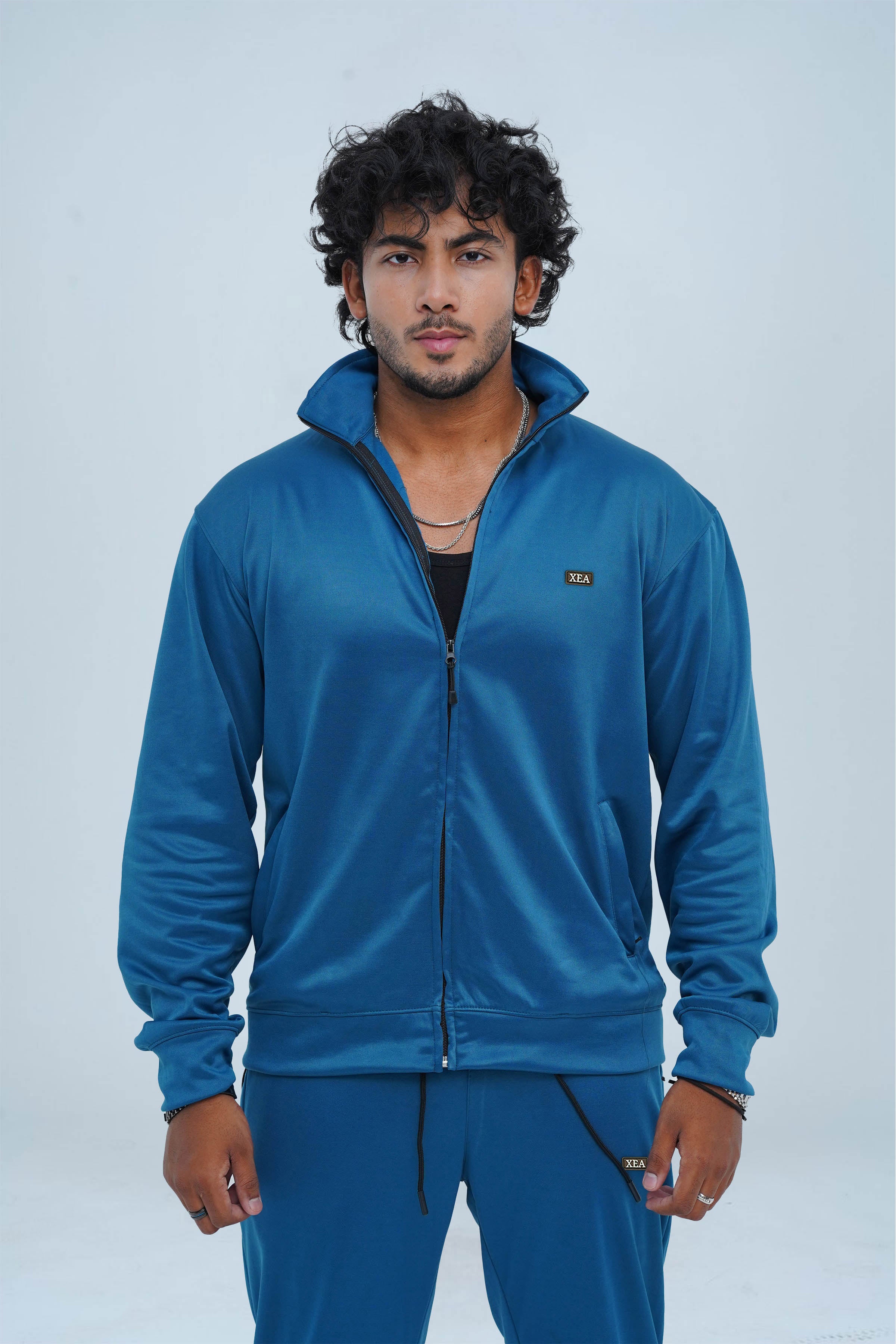 Get ready for winter with our Venice blue Men's High Performance Tracksuit. Designed with top quality materials, it offers optimal performance for your cold weather workouts. Its breathable, quick-drying fabric ensures comfort while the vibrant color adds style to any activity.