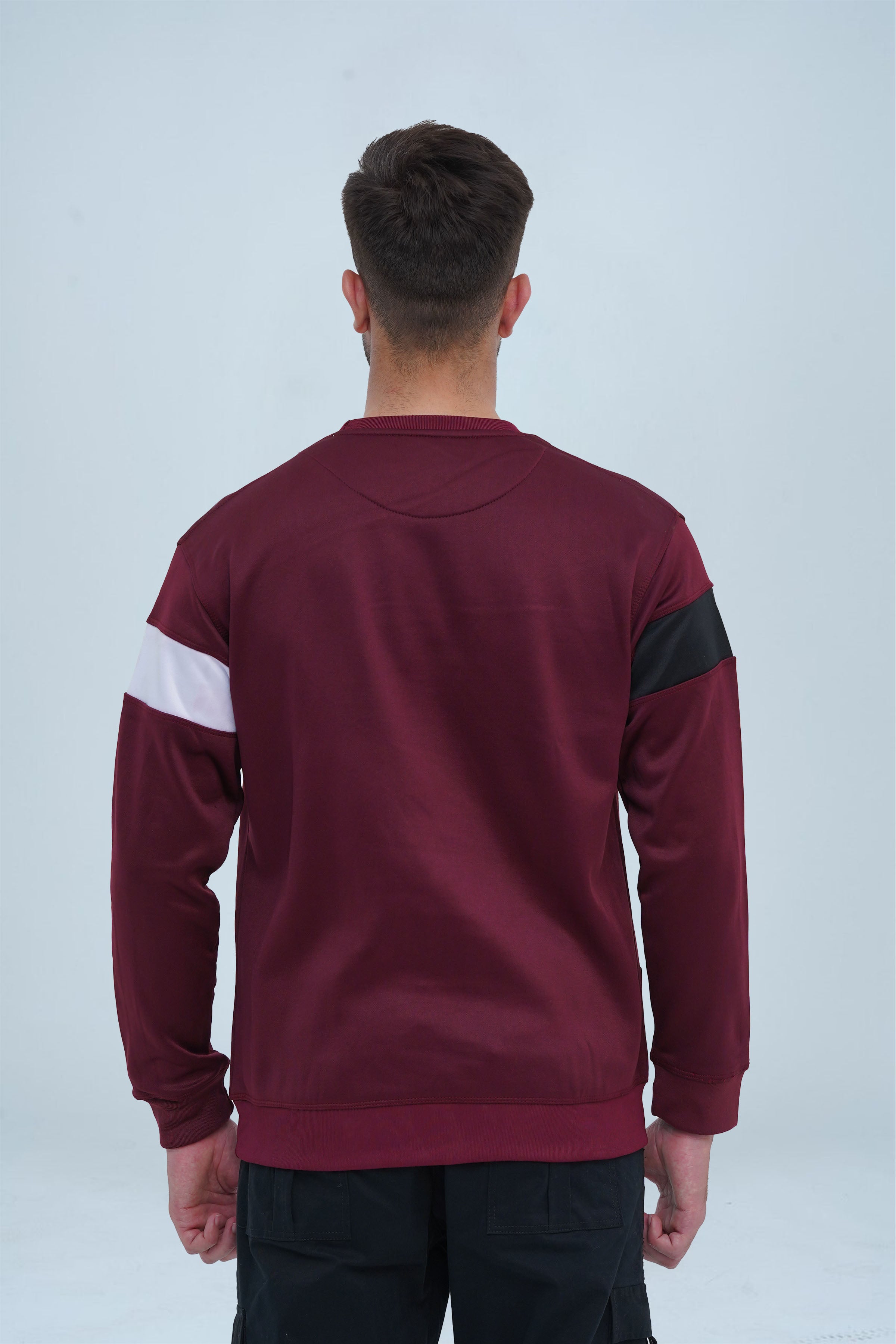 Rich maroon sweatshirt with a contrasting black and white stripe on the chest, adding a touch of athletic flair to the design