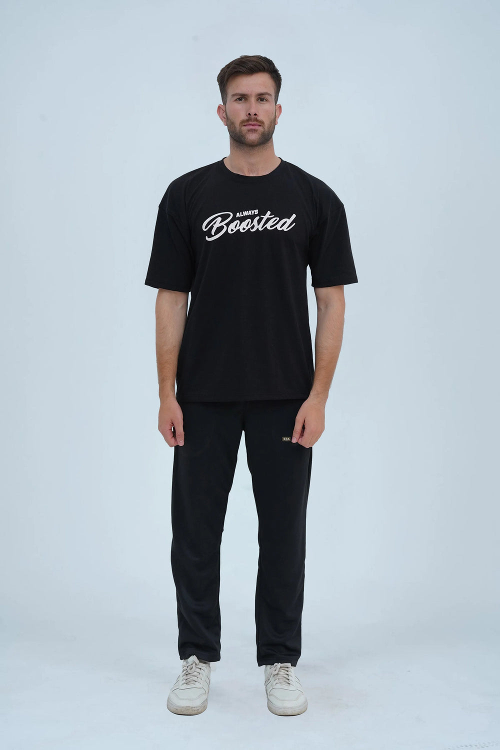 Automotive-inspired oversized black T-shirt from XEA Clothing, designed for off-road and street racing fans with 'Go Fast or Sleep' lettering. -  Boosted Oversized T-Shirt - Xea Clothing -  Boosted Oversized T-Shirt - Xea Clothing