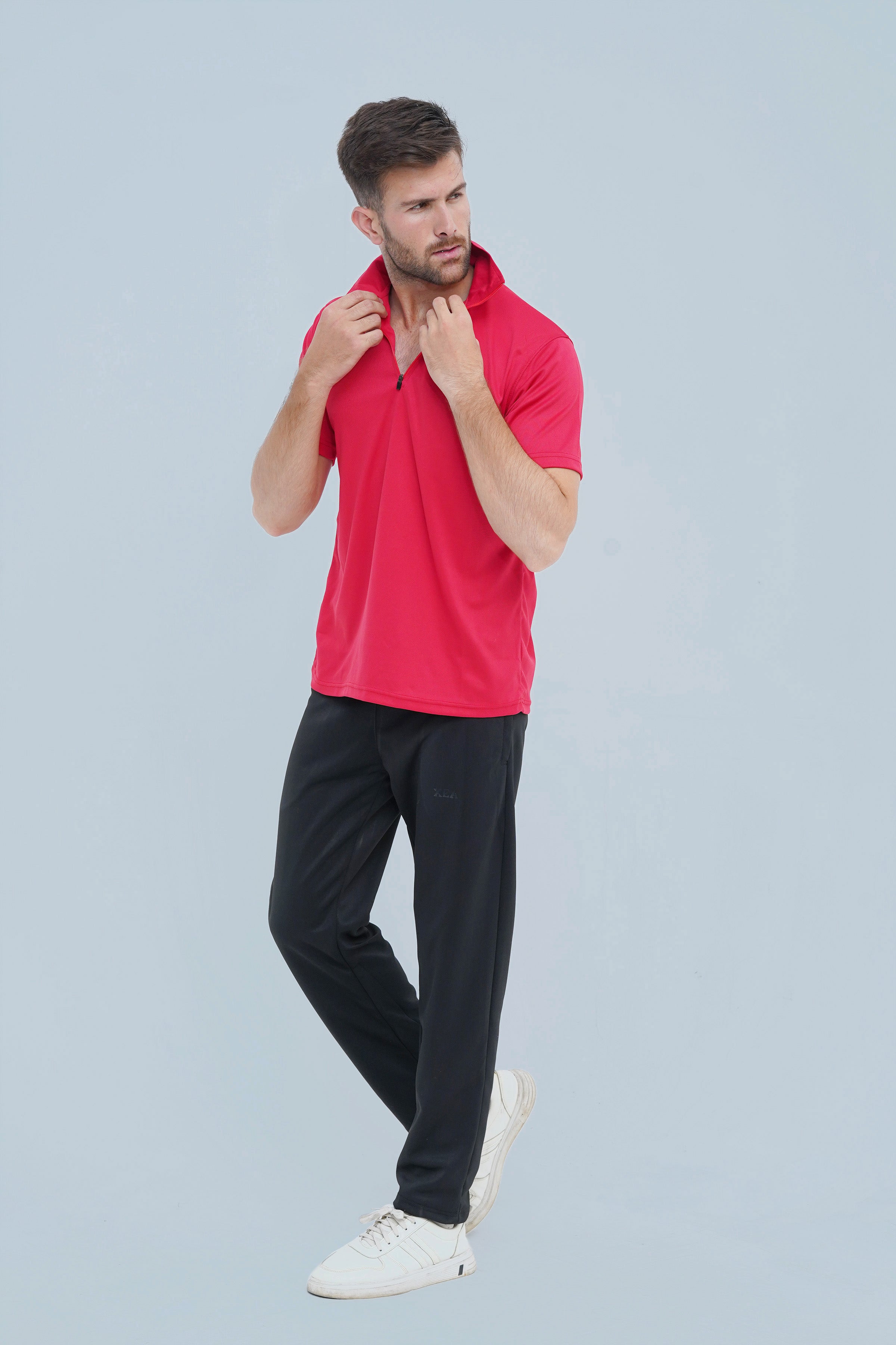 Xea Pique Polo Shirt in Soft Red. Timeless style meets high-quality fabric and a zip closure.