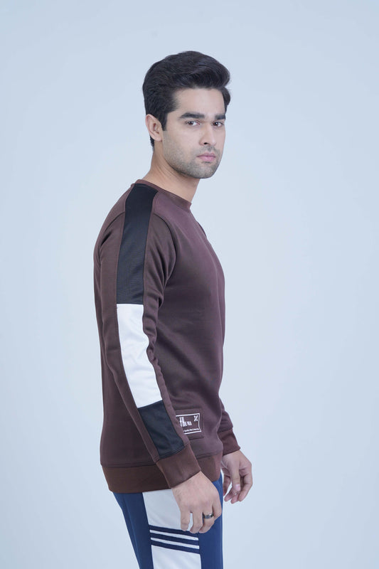 Casual brown pullover with contrasting black and white sleeve stripes, combining comfort with a touch of style