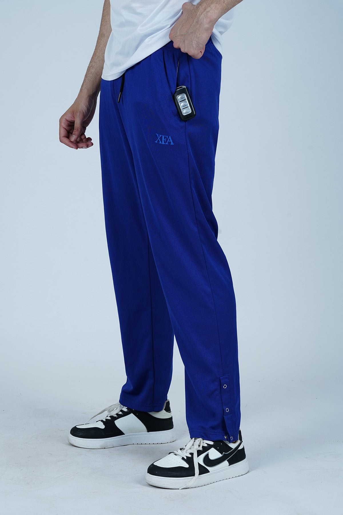 Royal Blue Men's Jogger pants have side double pockets and bottom hem with tree buttons for style and comfort.