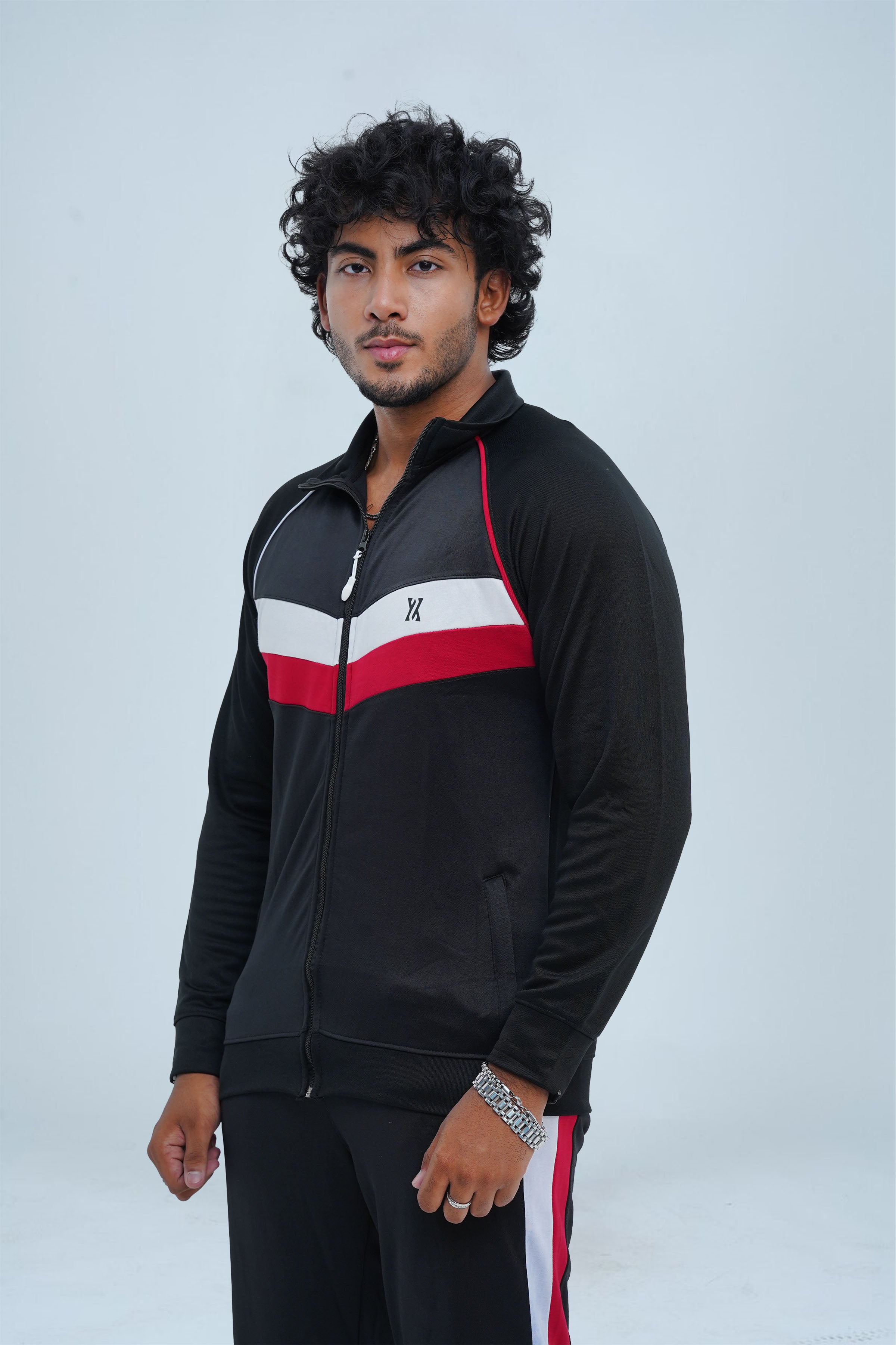 Stay stylish and warm this winter with our Men's Fitness Tracksuit in Black. Designed for top performance, this tracksuit features breathable fabric and striking red and white accents. Perfect for any workout, its flexible fit and bold design will keep you active and fashionable.