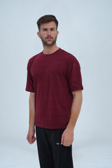 Deep maroon drop shoulder T-shirt with an oversized fit, soft fabric, minimalist design, and everyday comfort.