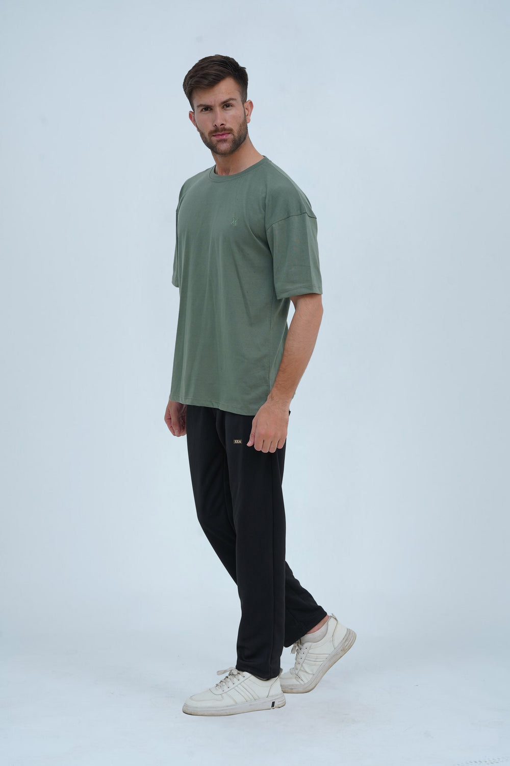 Fresh green drop shoulder oversized T-shirt – breathable fabric, minimal design, and a modern streetwear essential.