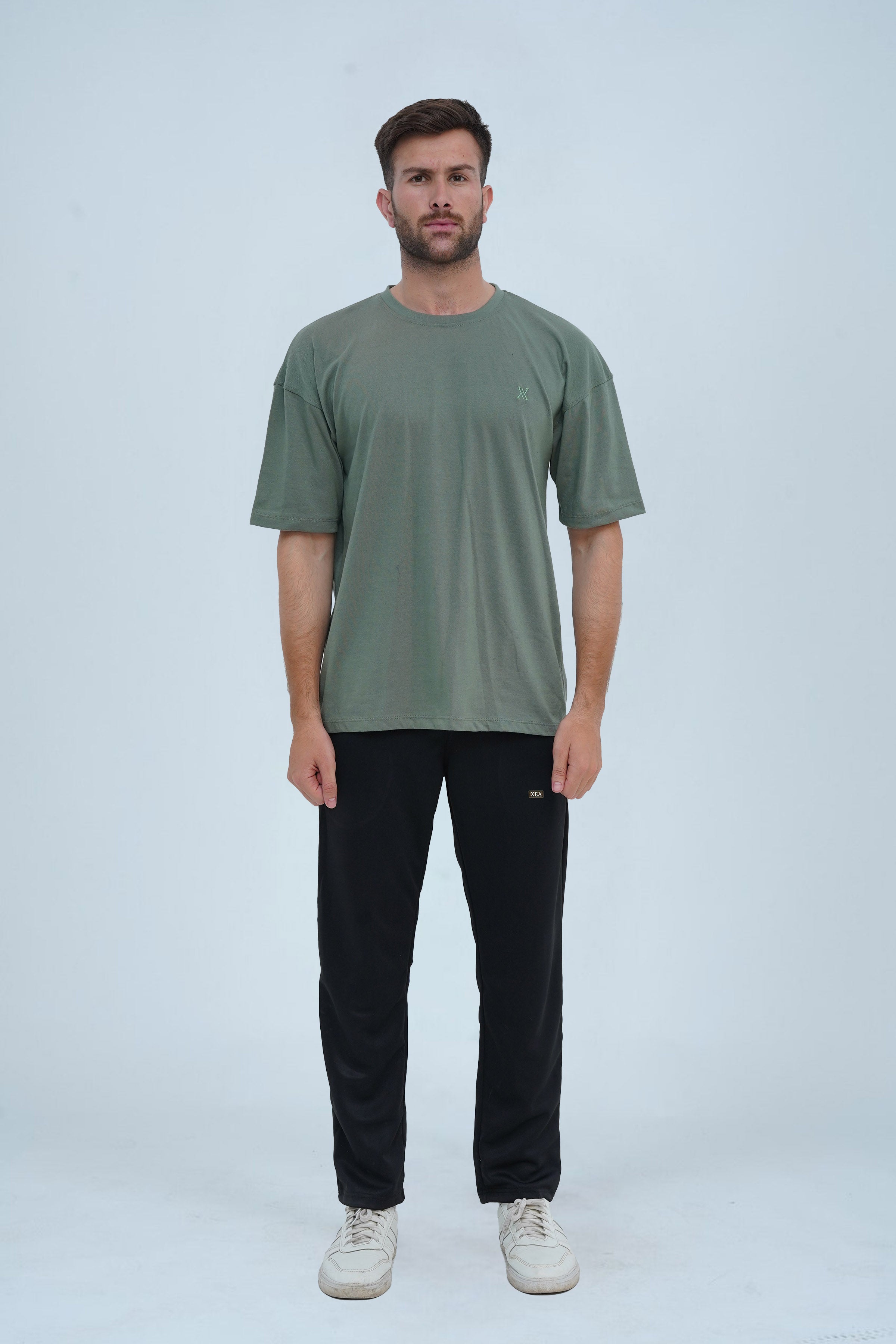 Summer green oversized drop shoulder T-shirt for men – relaxed fit, soft cotton, and perfect for casual and streetwear looks.