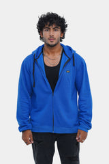 Man wearing a blue hoodie on a white background