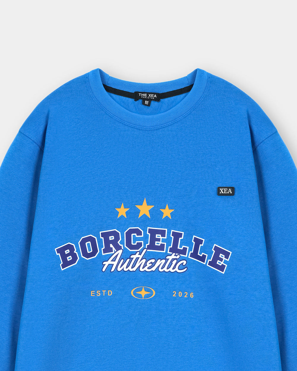 Blue sweatshirt with 'BORCELLE Authentic' text and branding on a light gray background