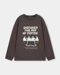 Brown sweatshirt with 'Discover the Art of Coffee' text and graphic on a light gray background