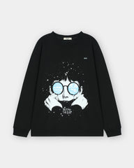 Black sweatshirt with a graphic design of a person wearing glasses and text 'BEYOND THE EYES' on a light gray background.