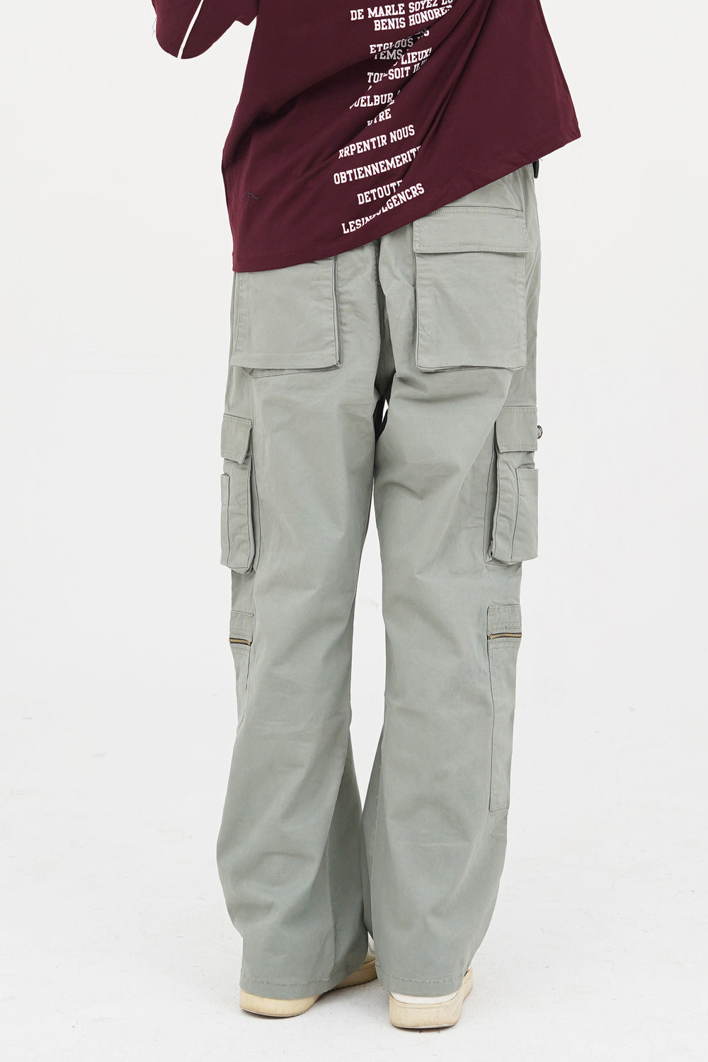 Light grey cargo pants for men in Pakistan with baggy streetwear fit and zip detail