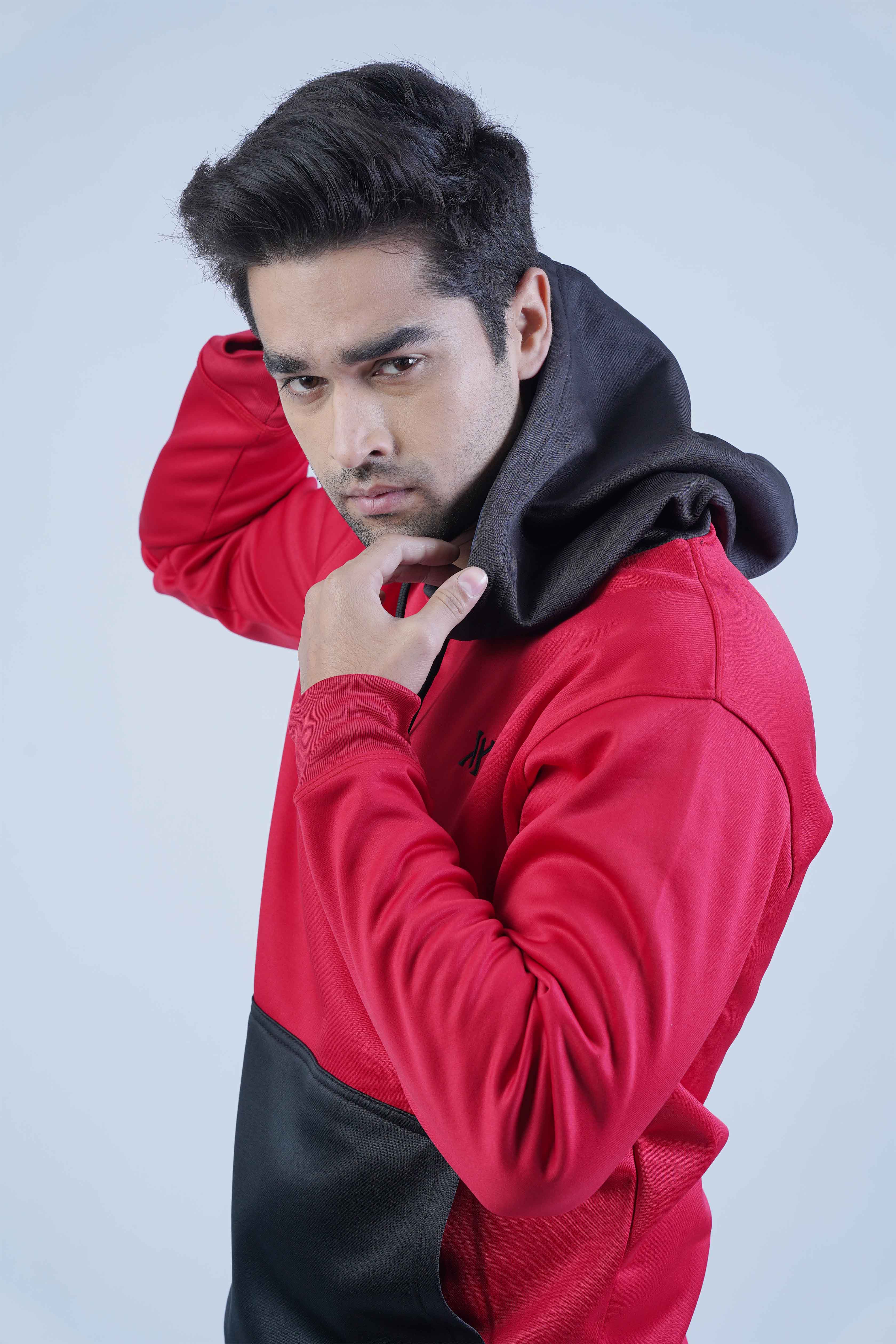 Get the perfect balance of comfort and style with this red and black pullover hoodie! Made with a red body, black hood, and front pocket, it's ideal for daily wear.