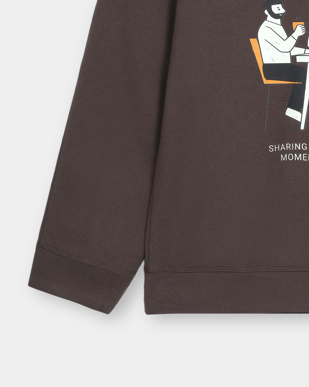 Brown sweatshirt with a graphic of a person sitting on a chair and text on a white background