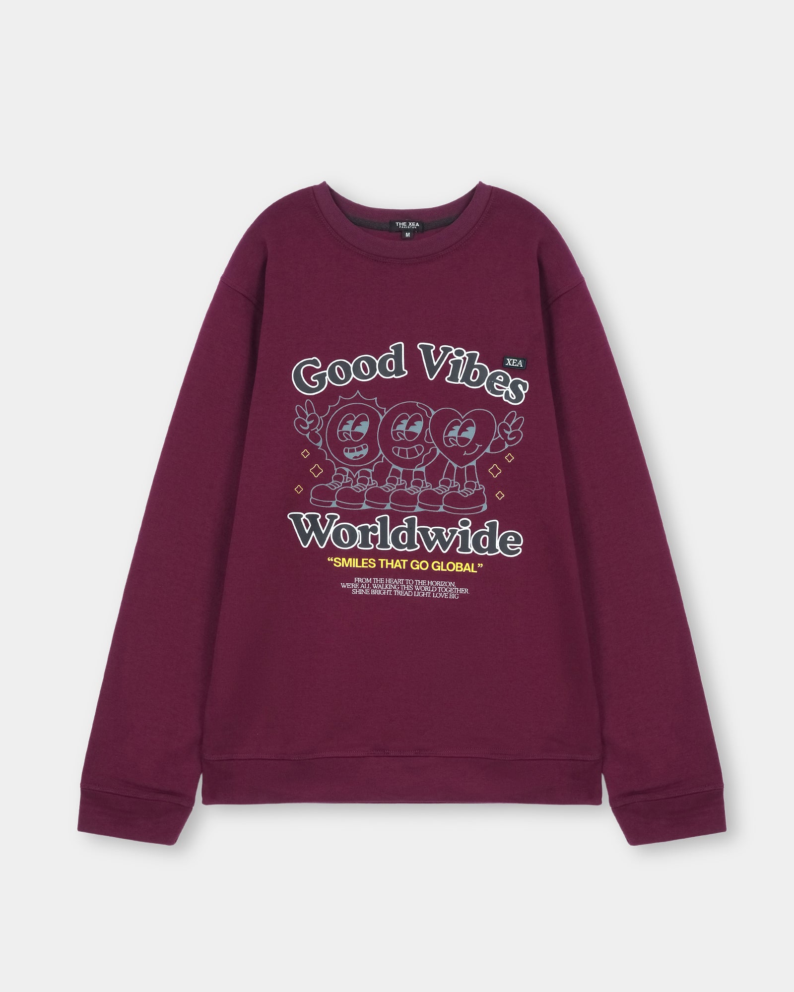 Maroon sweatshirt with 'Good Vibes Worldwide' text and cartoon characters on a light gray background